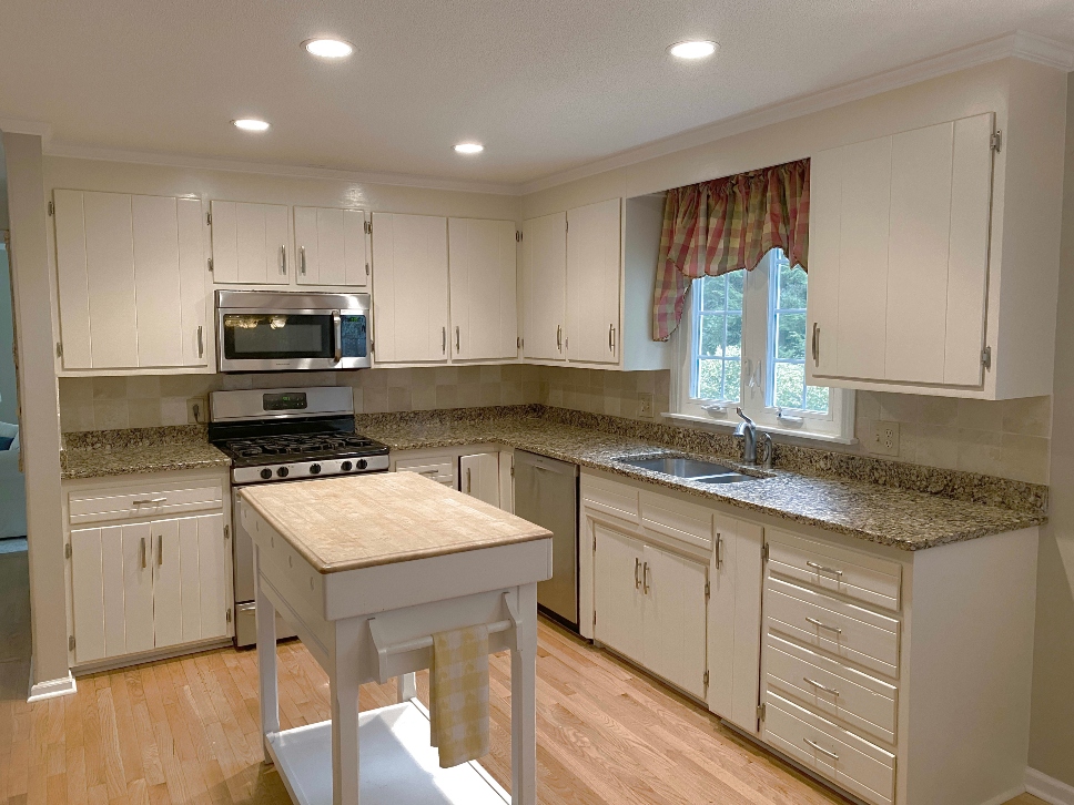 Before cabinet painting in Ludlow MA — dated cabinet finish before professional spray painting