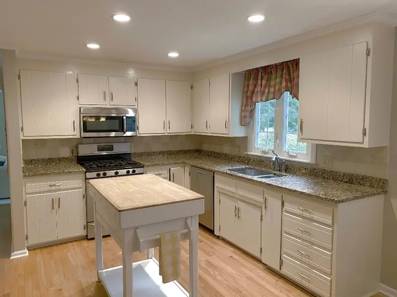 Before cabinet painting in Ludlow MA — dated cabinet finish before professional spray painting