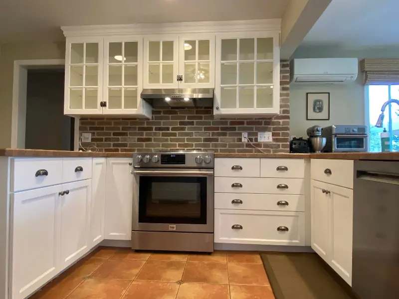 Farm-style white kitchen after professional cabinet refacing in Suffield, CT