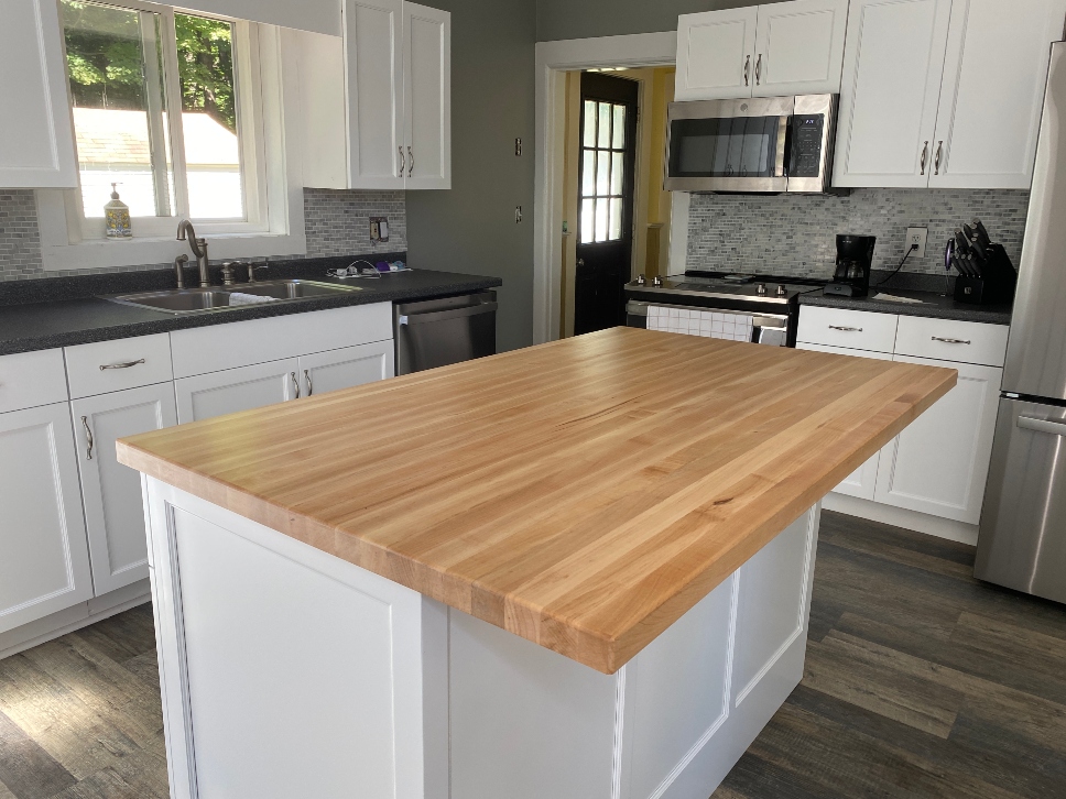Butcher block island countertop — custom wood butcher block top on kitchen island with natural warm finish