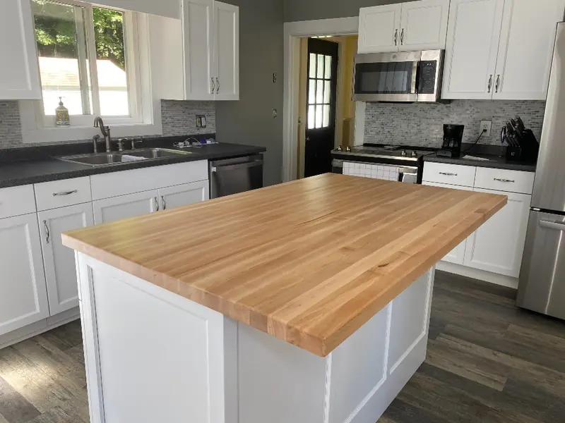 Butcher block island countertop — custom wood butcher block top on kitchen island with natural warm finish
