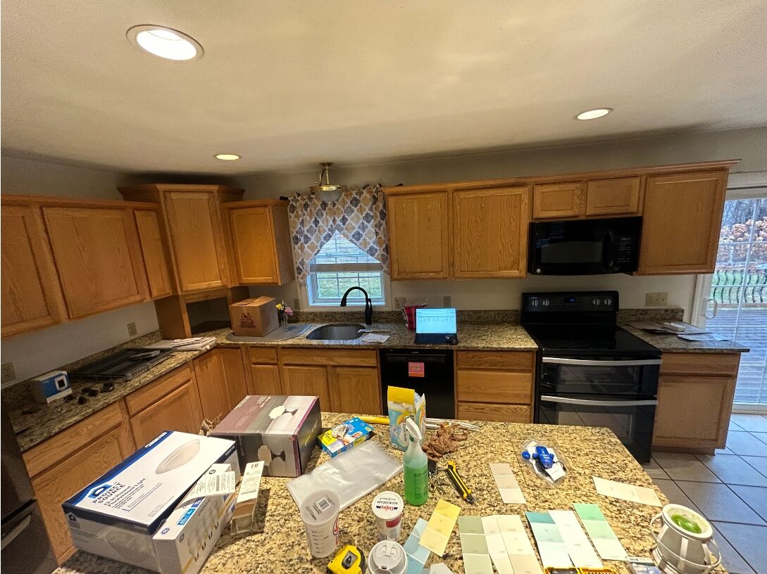 Dated kitchen cabinets before cherry wood cabinet refacing in Warren MA
