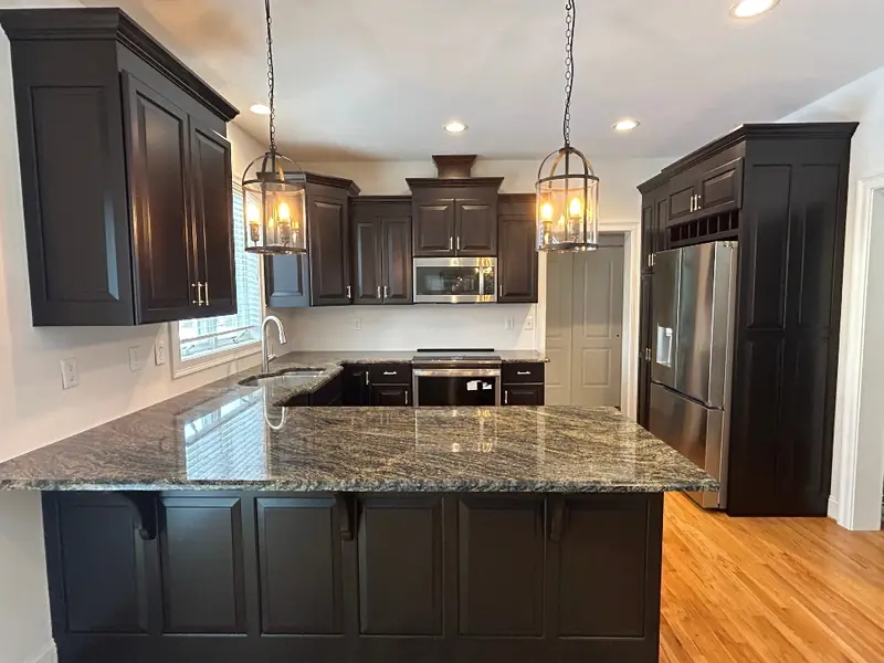 Oak cabinets refinished to a deep espresso tone — Homestead Cabinet Design Palmer MA