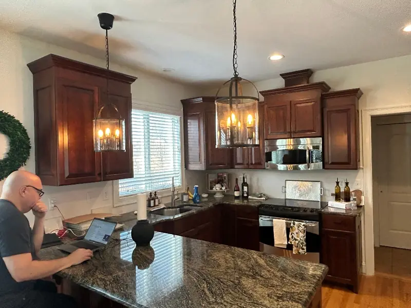 Worn, orange-toned oak kitchen cabinets before refinishing — Homestead Cabinet Design Palmer MA
