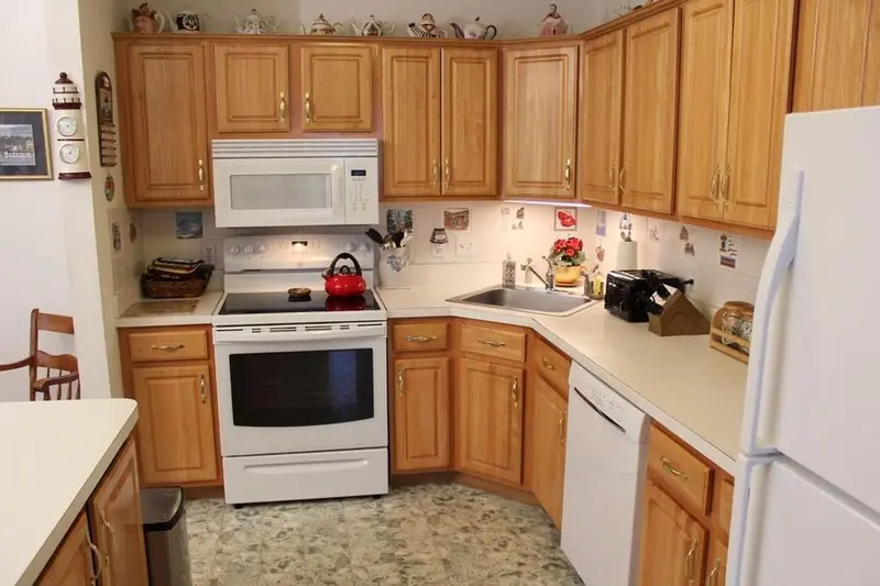 Dated kitchen cabinets before professional painting by Homestead Cabinet Design Palmer MA