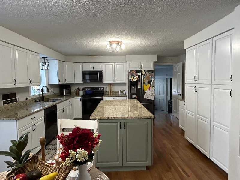 Cherry kitchen cabinets after professional white painting