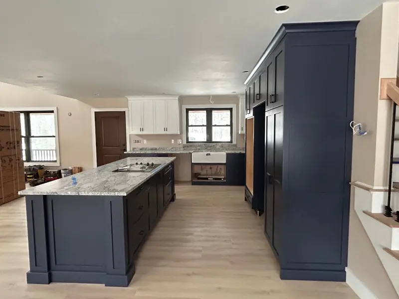 Custom-built kitchen cabinets in Hale Navy and white running to the ceiling — Homestead Cabinet Design Palmer MA