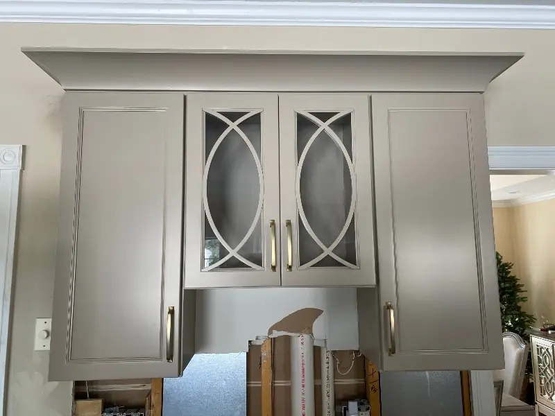 Decorative glass-front cabinet doors used as display boxes above kitchen cabinets — Homestead Cabinet Design Palmer MA