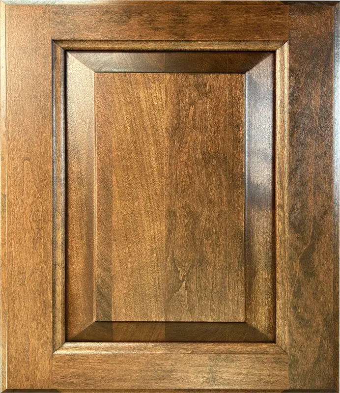 Cherry raised panel cabinet door with warm stained finish