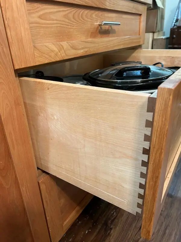 Dovetail-joined drawer box in a maple cabinet