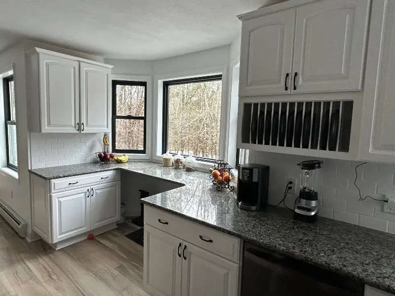 Bright white kitchen cabinets after professional refacing