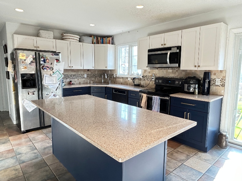 Custom white kitchen cabinet installation from full kitchen remodel