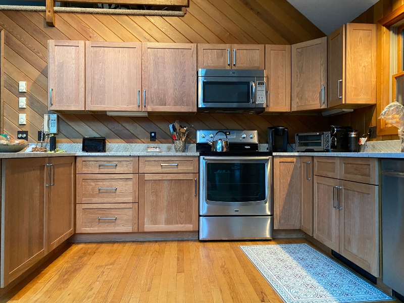 Rich wood kitchen remodel with custom cabinetry and new layout