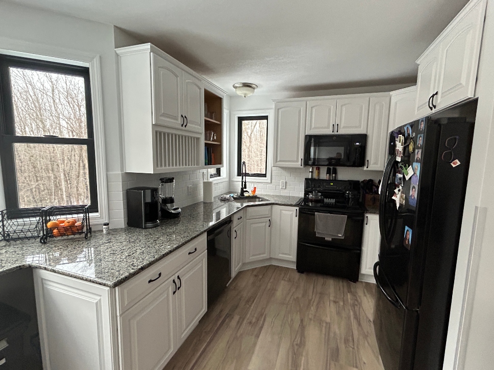 After cabinet painting in Chicopee MA — professionally painted kitchen cabinets with fresh color