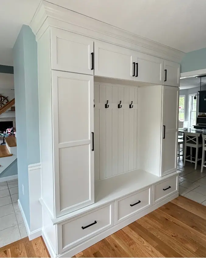 Custom mudroom bench with cubbies and overhead storage — Western Massachusetts