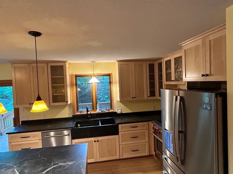 Natural maple cabinet refacing applied over existing oak kitchen cabinet boxes