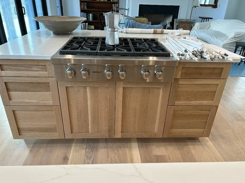 Custom kitchen island with solid wood construction and deep drawer storage — Western Massachusetts