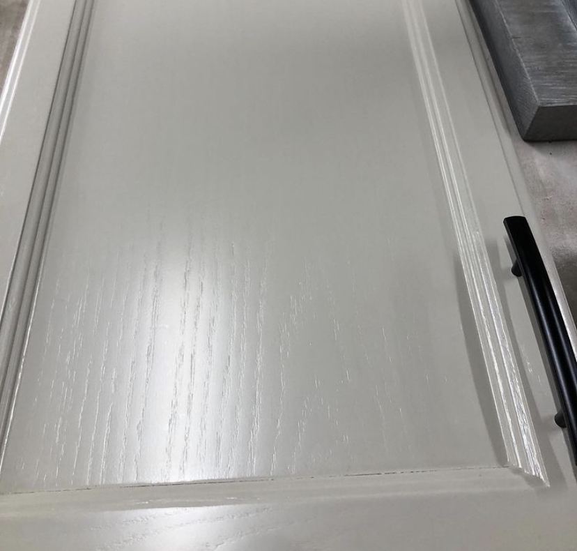Oak cabinet door painted white showing wood grain texture — Homestead Cabinet Design Palmer MA