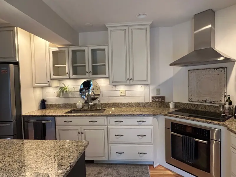 Professionally painted farm-style kitchen cabinet finish