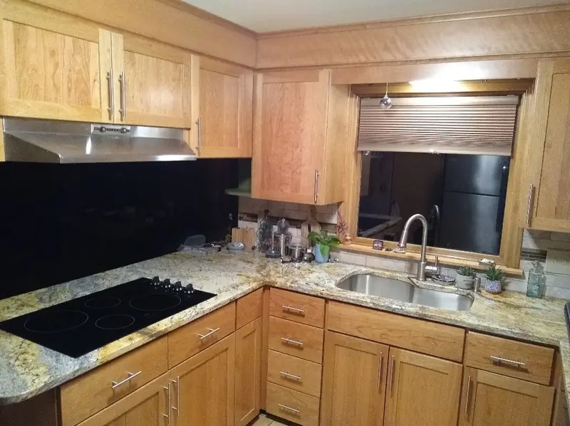 White shaker cabinet refacing completed in Longmeadow MA with updated hardware