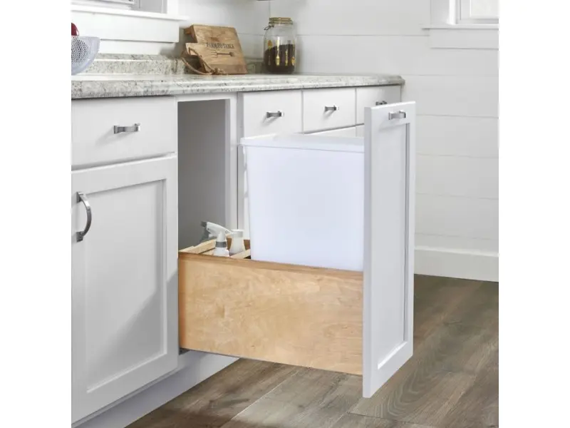 Single-bin trash pull-out in a white base cabinet