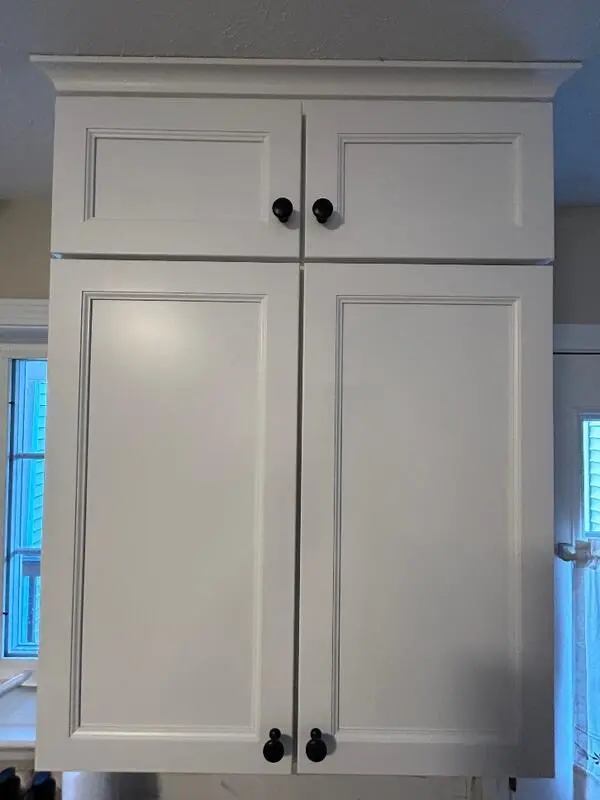 Small stacked cabinets added above existing upper cabinets for extra storage — Homestead Cabinet Design Palmer MA