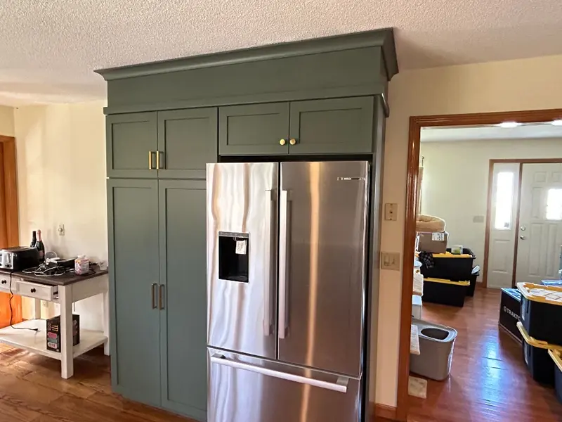 Soffit enclosed above kitchen cabinets in Chicopee MA before crown molding — Homestead Cabinet Design